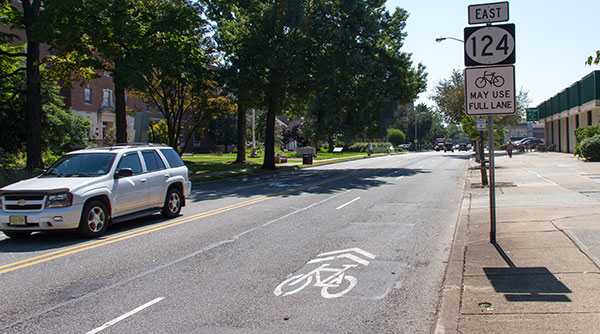 New Jersey roadway with a bicycle lane and signage